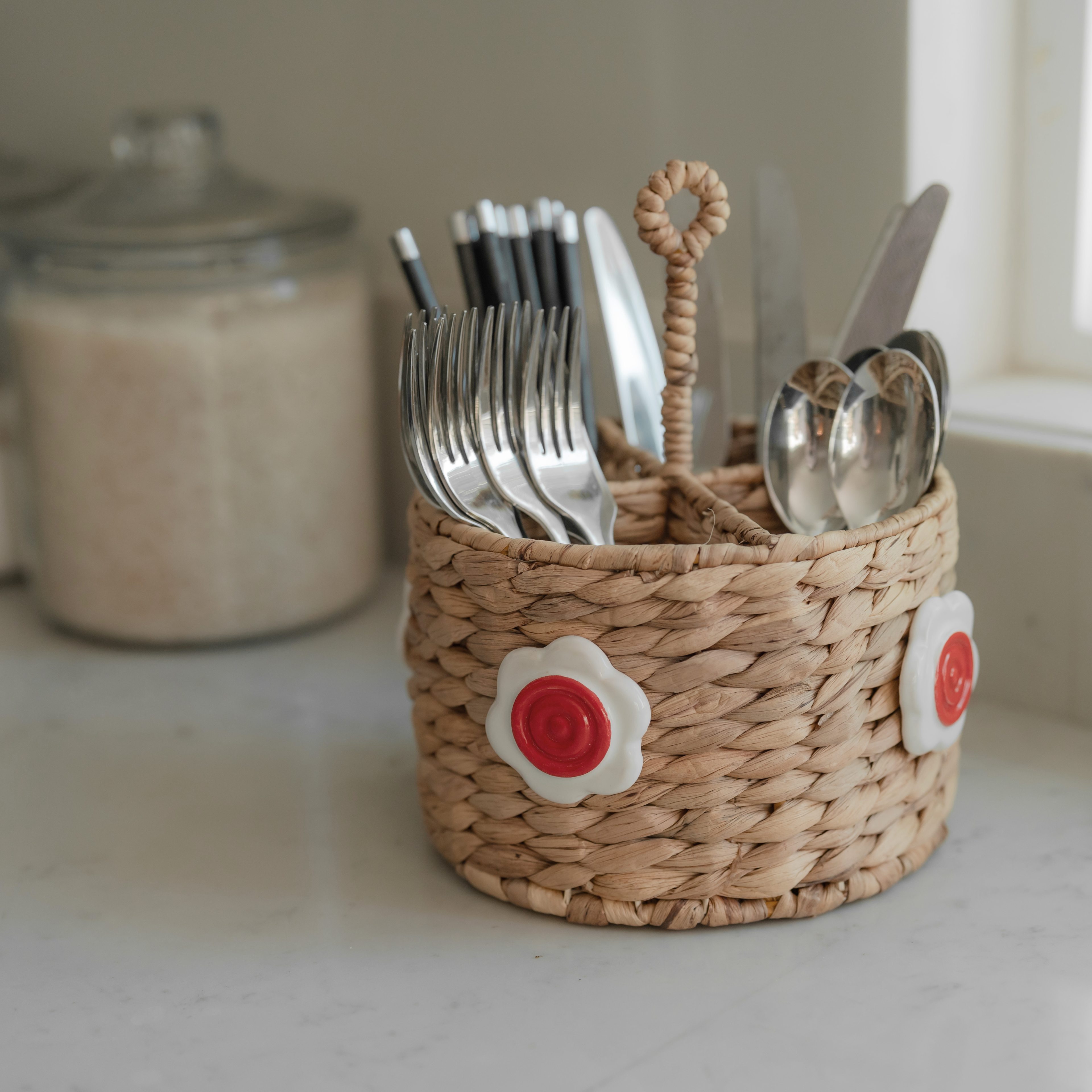 Handwoven Seagrass Utensil Holder with Red Ceramic Flower Accent